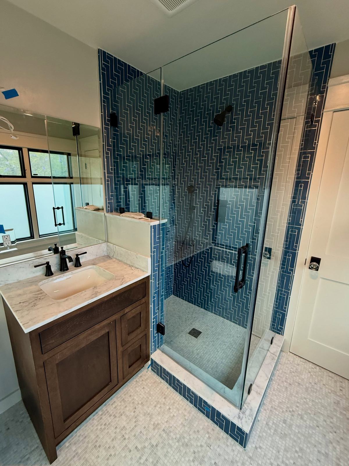 Bathroom with geometric tile shower