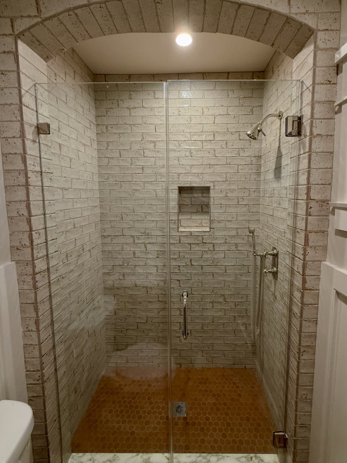 Shower with brick tile arch