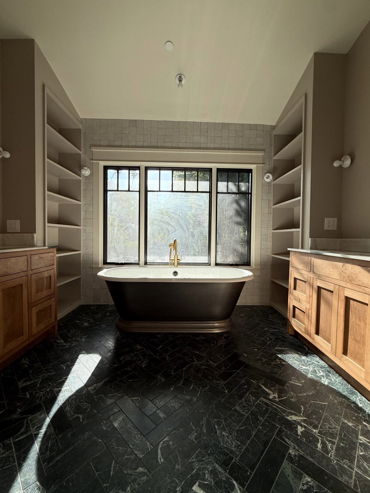 Bathroom with freestanding tub and marble floor